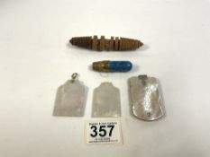 A TREEN NEEDLE AND COTTON HOLDER/REEL, TRAVEL POCKET THIMBLE AND COTTON HOLDER, AND TWO MOTHER O