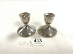 PAIR OF STERLING WEIGHTED SQUAT CANDLESTICKS, 8CMS