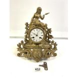 19TH CENTURY FRENCH GILT METAL MANTEL CLOCK WITH CIRCULAR WHITE ENAMEL DIAL FIGURE SURMOUNTED, 32CMS