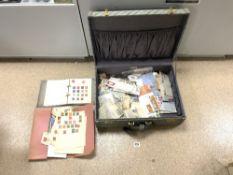 LARGE SUITCASE OF LOOSE STAMPS VARIOUS AND A STAMP ALBUM