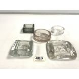 FIVE ERIC HOGLAND CLEAR GLASS EMBOSSED PAPERWEIGHTS