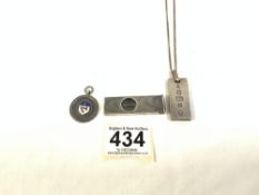 HALLMARKED SILVER ENGINE TURNED CIGAR CUTTER, HALLMARKED SILVER INGOT ON CHAIN, AND ENAMEL FOB