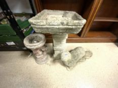 THREE RECONSTITUTED CONCRETE GARDEN ITEMS, TWO BIRD BATHS AND OTTER