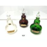 THREE VINTAGE PEAR-SHAPED COLOURED MEDICINE BOTTLES 24CMS