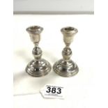 A PAIR OF 800 STAMPED WHITE METAL BALUSTER-SHAPED CANDLESTICKS, 10CMS, 86 GRAMS