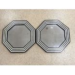 PAIR OF OCTAGONAL EBONY AND IVORY EFFECT WALL MIRRORS, 60CMS