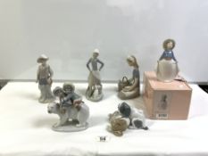 LLADRO GROUP OF TWO CHILD ESKIMOS ON A POLAR BEAR, THREE LLADRO FIGURES, AND A NAO PUPPY GROUP,