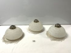 A SET OF THREE FROSTED GLASS HANGING LAMPS WITH LONG DROPS