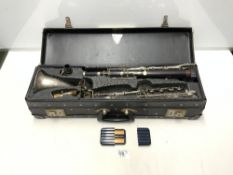 A BASS CLARINET IN FITTED CASE BY 'CONN', SERIAL NUMBER - M64647