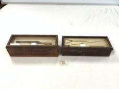 TWO GLASS TOP LEATHER BOXES WITH MINIATURE GUN AND FISHING DISPLAY