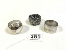 TWO HALLMARKED SILVER NAPKIN RINGS, WITH ONE WHITE METAL