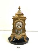 A 19TH-CENTURY FRENCH GILT METAL AND PORCELAIN MANTEL CLOCK, WITH A HAND-PAINTED PORCELAIN PANEL AND
