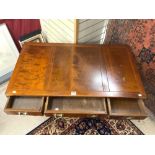 A MILITARY STYLE MAHOGANY BRASS CORNER END HANDLED THREE DRAWER DESK ON UNUSUAL DOUBLE X STRETCHER