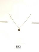 375 GOLD 9-CARAT 18-INCH NECKLACE WITH A 375 GOLD PENDANT LOCKET WITH A SINGLE GARNET, 4.4 GRAMS