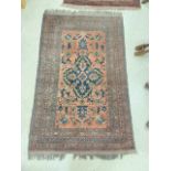 PERSIAN RED GROUND WOOLLEN RUG (200 X 126CMS)