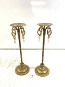 A PAIR OF MODERN GILT METAL CANDLESTANDS WITH GLASS DROPS FEATURE. 37.5CMS