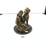 A 20TH-CENTURY POLISHED BRONZE GROUP OF A GIRL EATING FRUIT WITH A RETRIEVER DOG, 23CMS