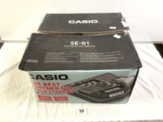 A CASIO SE-G1 ELECTRONIC CASH REGISTER IN THE BOX