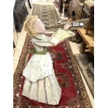 A RUSTIC PAINTED WOODEN AND METAL FIGURE OF A LADY PLAYING INSTRUMENTS, 96CMS