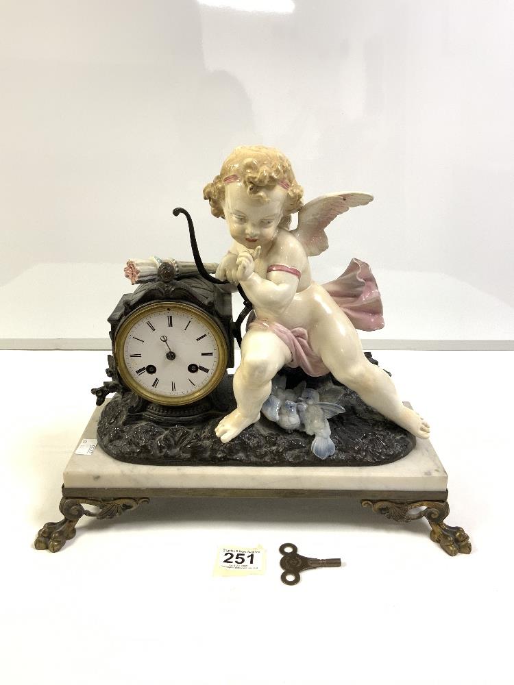 JAPY FRERES MANTLE CLOCK, WHITE MARBLE BASE WITH A CHERUB A/F ON A BRASS PLINTH WITH LION PAW