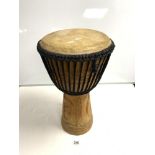 A CARVED WOODEN AFRICAN DRUM