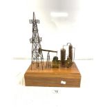 KEN TATYREK SIGNED COPPER AND BRASS MINING SCULPTURE ON A WOODEN BASE, 32 X 42CMS