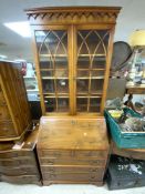 A REPRODUCTION YEWOOD BUREAU BOOKCASE WITH TWO GLAZED DOORS OVER, MADE BY REPRODUX (80 X 42 X