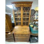 A REPRODUCTION YEWOOD BUREAU BOOKCASE WITH TWO GLAZED DOORS OVER, MADE BY REPRODUX (80 X 42 X