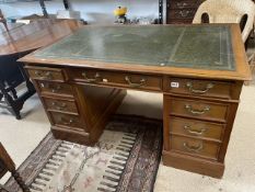 VINTAGE MAHOGANY WRITING DESK WITH NINE DRAWERS AND GREEN TOOLED LEATHER TOP (139 X 85CMS)