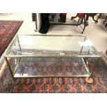 A BRASS AND GLASS TWO TIER COFFEE TABLE (98 X 46 X 43CMS)