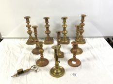 FOUR PAIRS OF VICTORIAN BRASS CANDLESTICKS, A SINGLE GEORGIAN BRASS CANDLESTICK WITH PUSHER, AND A