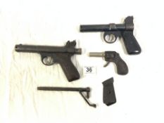 TWO VINTAGE WEBLEY JUNIOR AIR PISTOLS 177, AND A TOY TINPLATE PISTOL - STAMPED HOWE RMC