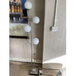 A RETRO CHROME FOUR BRANCH LAMP STAND WITH WHITE GLASS SHADES