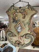 A FAIRGROUND PAINTED AND MIRRORED SHIELD-SHAPED DOUBLE-SIDE HANGING WOODEN PANEL FROM ANCIENT