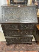 VICTORIAN CARVED OAK BUREAU, WITH FOUR DRAWERS (74 X 48 X 106CMS)