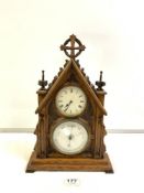 A CARVED OAK EARLY 20TH CENTURY CLOCK WITH ANEROID BAROMETER 41CMS