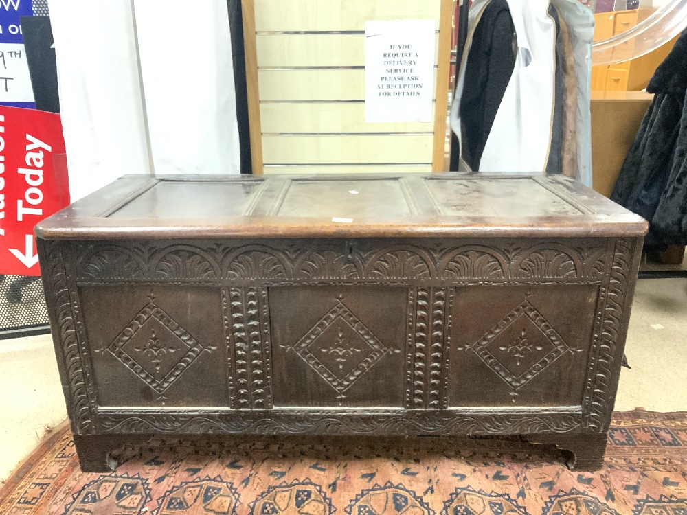 ANTIQUE PANELLED OAK COFFER, WITH LATER CARVING TO FRONT, 126X56X50 CMS. - Image 4 of 5