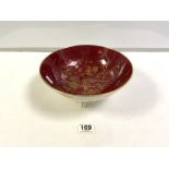 A COALPORT RED AND GOLD DECORATED PORCELAIN BOWL ON THREE SCROLL FEET 26 X 10 CM