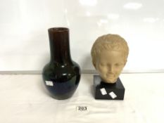 RESIN HEAD OF A CHILD WITH A LUSTRE GLAZED VASE 25 CMS