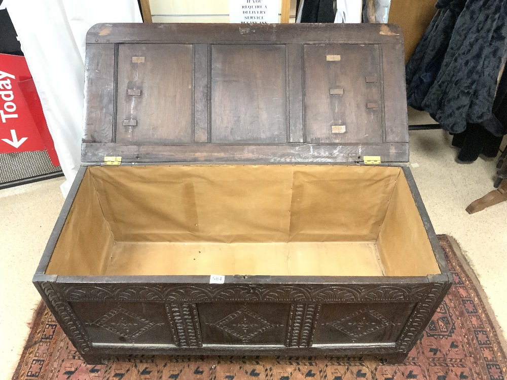 ANTIQUE PANELLED OAK COFFER, WITH LATER CARVING TO FRONT, 126X56X50 CMS. - Image 2 of 5