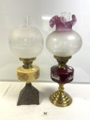 TWO VICTORIAN STYLE BRASS AND CAST IRON OIL LAMPS WITH ETCHED GLASS SHADES