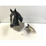 A BLACK CERAMIC BUST OF A HORSE AND A SMALL HORSE WALL PLAQUE