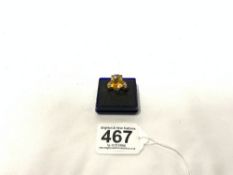 A 10K MARKED YELLOW METAL AND CITRINE AND DIAMOND SET DRESS RING.