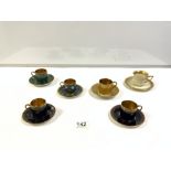 FIVE ROSENTHAL DECORATIVE COFFEE CANS AND SAUCERS AND A THOMAS/BRAVAVIA GOLD-DECORATED COFFEE CAN