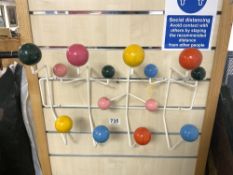 A RETRO SPUTNIK DESIGN MULTI COLOUR COAT RACK.