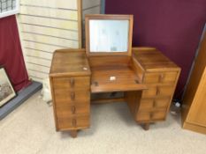 A 1950"S HEALS MAHOGANY ENCLOSED MIRRORED DRESSING TABLE, WITH EIGHT DRAWERS ON SQUARE TAPER LEGS.