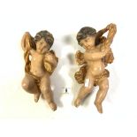 TWO PLASTER AND PAINTED HANGING CHERUBS