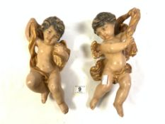 TWO PLASTER AND PAINTED HANGING CHERUBS