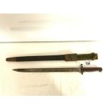 BRITISH MILITARY BAYONET IN SHEATH, MAKER WILKINSON, WITH CROWN ON BLADE AND DATED, 1907. BLADE-
