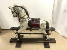 A HANDMADE IN ENGLAND PAINTED ROCKING HORSE, IN VERY GOOD CONDITION. MAKER- JOLLY ROCKERS.